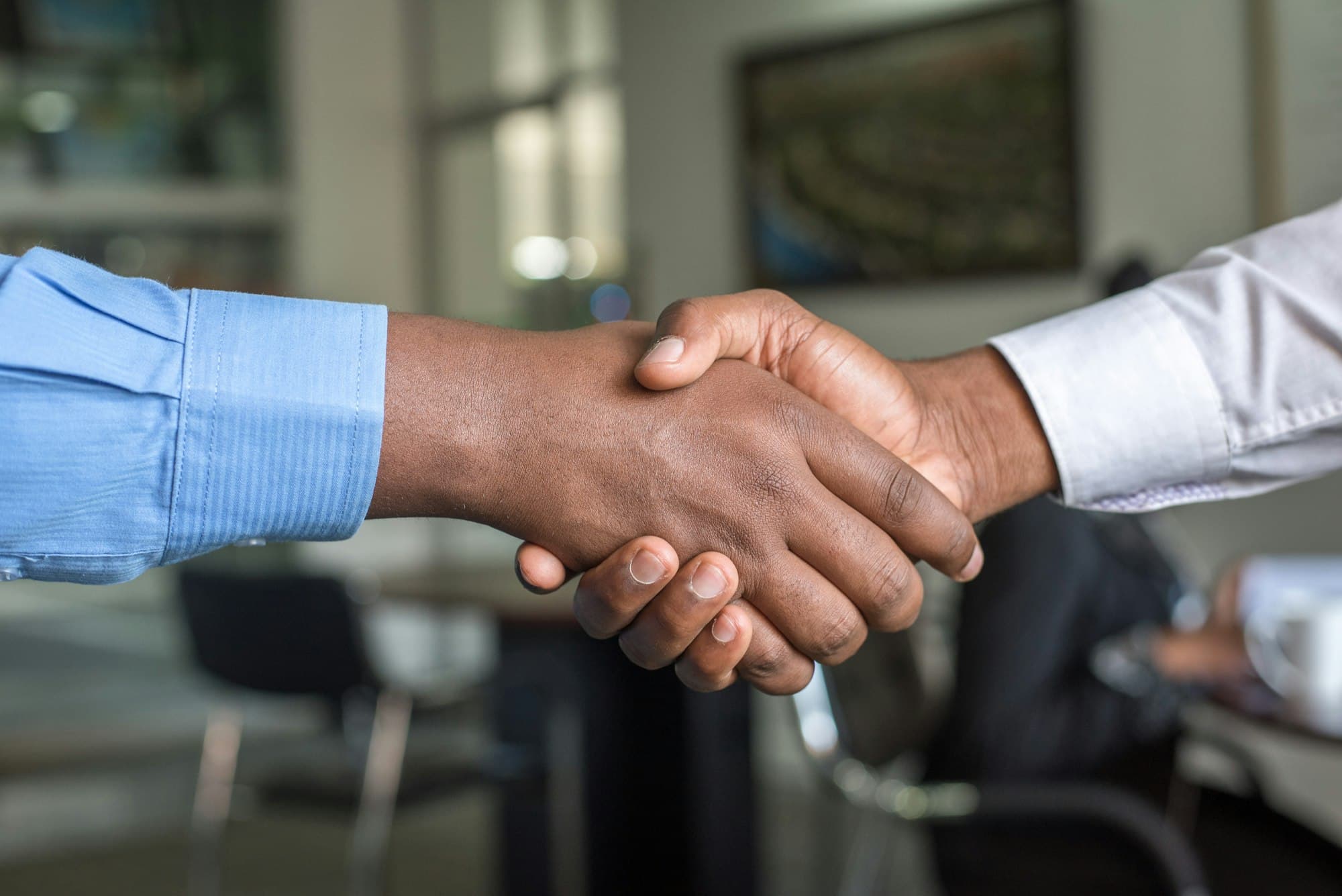 Two people shaking hands — the start of a working partnership